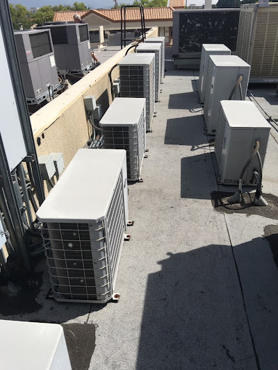 A collection of air conditioning units on a roof