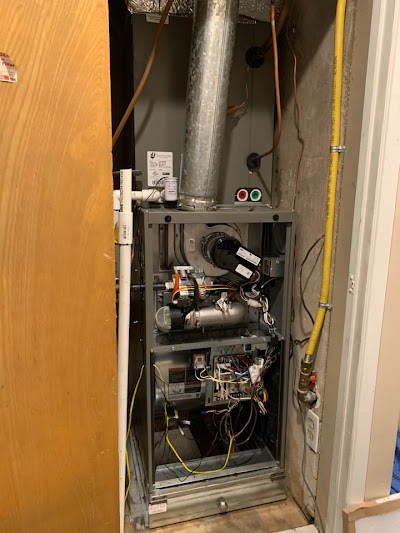 A gas furnace installed in a small room